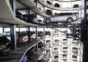 Brand new Volkswagen cars stand stored in a tower at the Volkswagen Autostadt complex near the Volkswagen factory on March 10, 2015 in Wolfsburg, Germany. Volkswagen is Germany's biggest carmaker and is scheduled to announce financial results for 2014 later this week. Customers who buy a new Volkswagen in Germany have the option of coming to the Autostadt customer service center in person to pick up their new car.